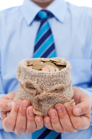 Businessman holding a bag of euro coins - community funding conceptの写真素材