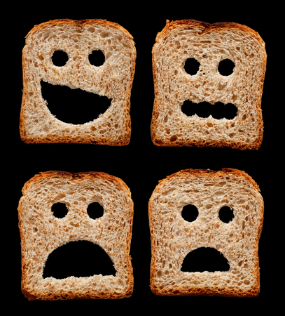 Happy, worried, shocked and frightened faces made of bread slices - isolated on black