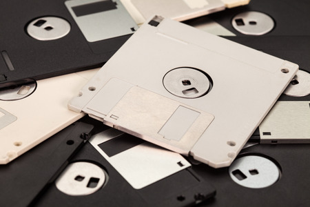 3.5 inch computer floppy disks layer - vintage storage media technology backgroundの写真素材
