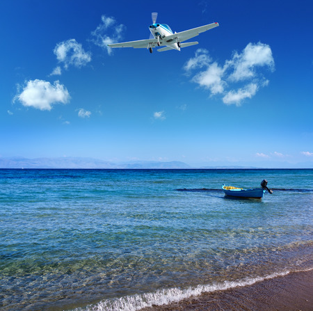 Small boat near the shore on the mediterranean sea - Corfu island, Greeceの写真素材