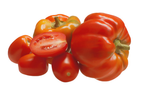 Two sweet bell peppers with tomatoes.Ingredients for cookingの写真素材