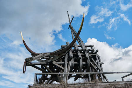 Nikola-Lenivets, KALUGA REGION, Russia - 15 may, 2022. Sculpture wooden gilded taurus. Ugra National...