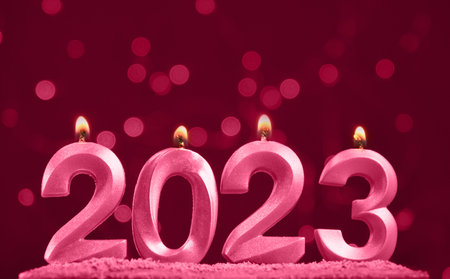 Minimalistic horizontal pink background with bright bokeh garland and space for text or design....