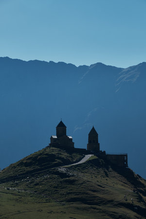 Gergeti Trinity Church, Stepantsminda village, Kazbegi. Summer trip to Georgia country, Nature of...