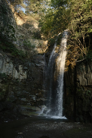 Waterfall in the center of Tbilisi. Botanical garden in the old town. A beautiful and unusual popular tourist natural place in the city center. No peopleの写真素材