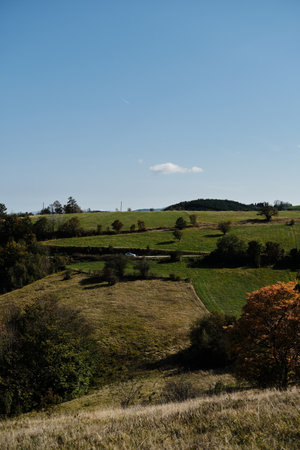 The nature of southwestern Serbia in early autumn. Endless fields and trees with orange leaves...