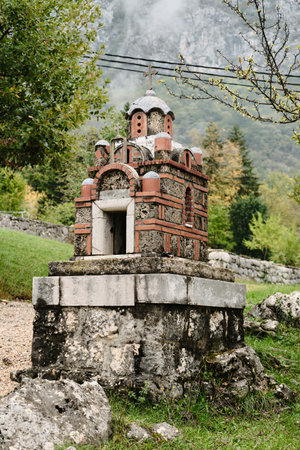 Old stone Christian church on a serpentine in the mountains. Montenegro country