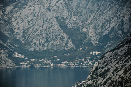 Montenegro country, Kotor bay and city with houses with red tiled roofs on sunny summer day, view...