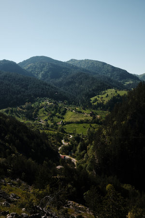 Panoramic spring view of Tara National Park with canyon, river, forest and distant village rooftops. Travel in Serbia country conceptの写真素材