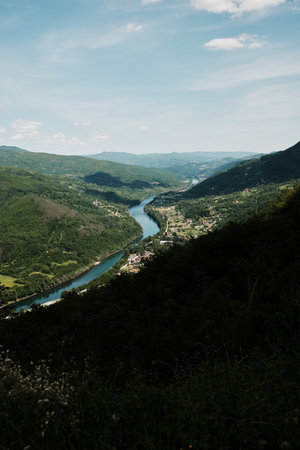 Aerial view of winding river Drina flowing through green valleys in Tara National Park, Serbia in spring seasonの写真素材