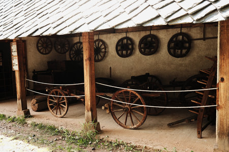 Old wooden carts and wheels inside an open-air museum in Staro Selo, Serbiaの写真素材