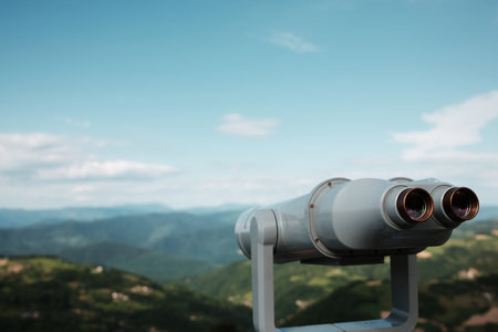 Tourist binoculars overlooking a breathtaking mountainous landscape in Serbia during springtime