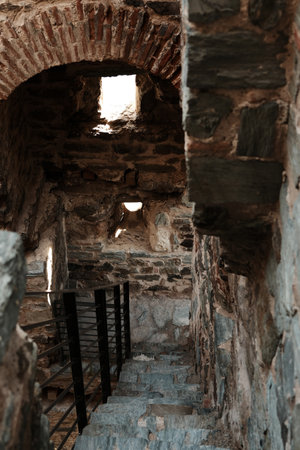 Stone stairway and arched windows inside Ram Fortress showing medieval architecture in Serbia