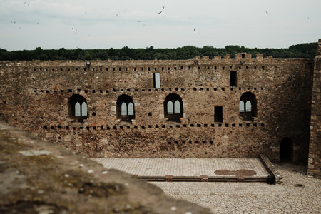 Interior courtyard and stone facade with arched windows in Smederevo Fortress, Serbia, overlooking the Danubeの写真素材
