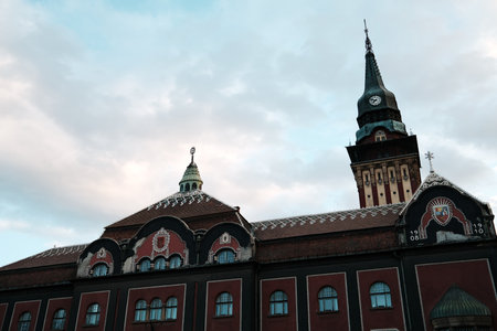 The iconic City Hall in Subotica, Serbia with its colorful facade and tall clock tower, seen in beautiful afternoon lightの写真素材