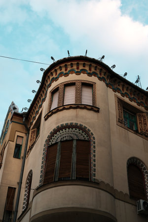 Decorative art nouveau corner building in Subotica, Serbia, with ornate windows and colorful trim details. Hungarian architecture in Serbia countryの写真素材