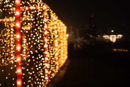 Rows of glowing Christmas lights create a magical tunnel of festive illumination at the Belgrade Christmas marketの写真素材