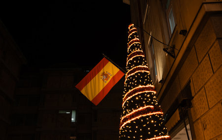 Christmas tree with lights and Spanish flag on Knez Mihailova street in Belgrade at nightの写真素材