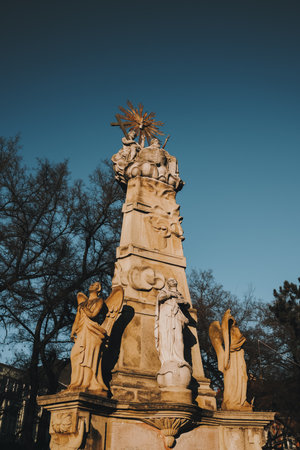 Baroque monument with angels and religious figures in Subotica, Serbia, during winterの写真素材