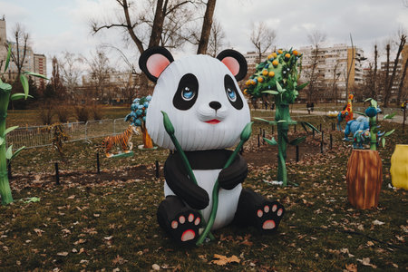 Cute panda lantern decoration holding bamboo in a Novi Sad park during winter celebration. Decoration for Chinese New Year.の写真素材