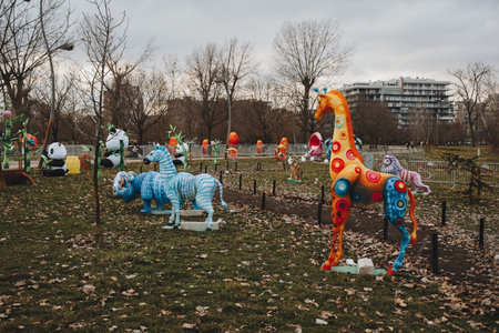 Colorful giraffe and other animal lantern decorations at Chinese New Year park festival in Novi Sadの写真素材