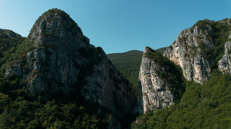 Close aerial view of dramatic rocky cliffs in Jerma Canyon mountains, Serbia country, surrounded by...
