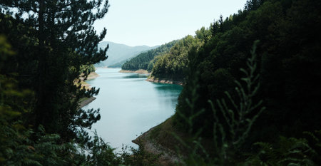 Picturesque view of Zaovine Lake nestled between forested hills in Tara National Park, Serbiaの写真素材