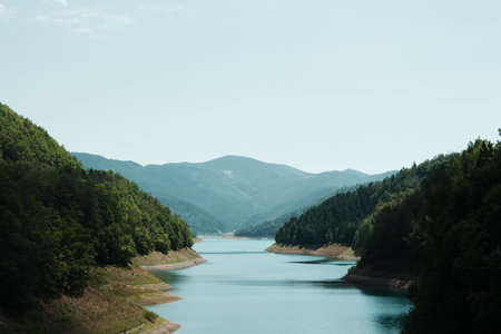 Picturesque view of Zaovine Lake nestled between forested hills in Tara National Park, Serbiaの写真素材
