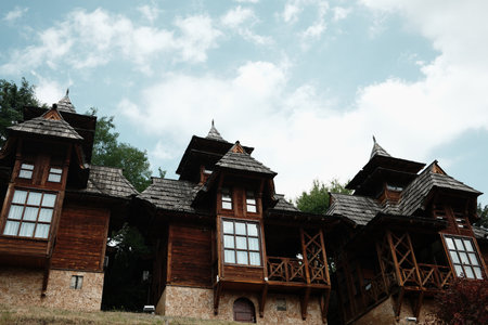 Traditional wooden houses in Mokra Gora, Serbia, with pointed rooftops and rustic designの写真素材