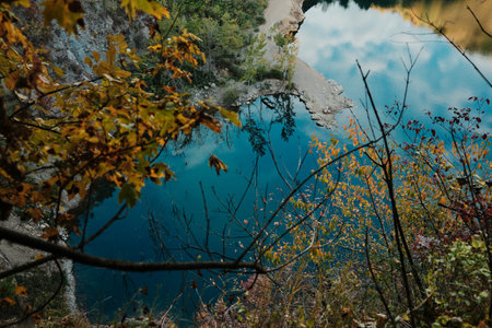 Beautiful view of Ledinci Lake surrounded by colorful autumn forest in Fruska Gora National Park Serbiaの写真素材
