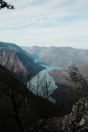 View of Perucac Lake stretching through mountain canyon from rocky viewpoint in Tara National Park,...