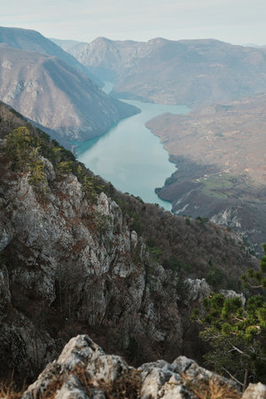 View of Perucac Lake stretching through mountain canyon from rocky viewpoint in Tara National Park,...