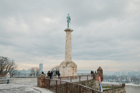 Victory Monument standing on fortress plateau with city skyline and snow in Belgrade. Belgrade,...