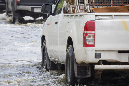 Splash by a car as it goes through flood waterのeditorial素材