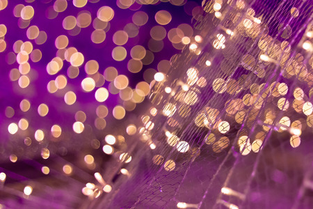Defocused christmas lights on purple colors toneの写真素材