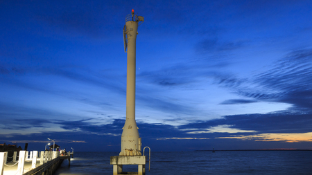 Lighted Beacon or Leading Light with Sunsets and Clouds at bang pu seaside, Samutprakarn, Thailandの写真素材