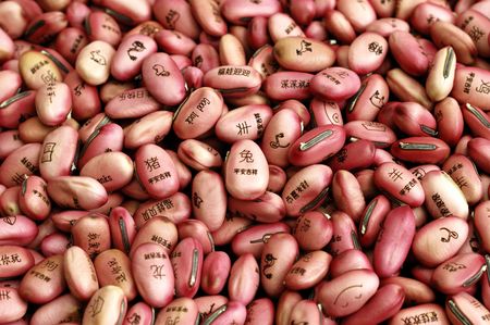 Bean seeds with character and sign for luck branded on it の写真素材