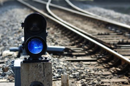 Signal lamp where railway goes to different waysの写真素材