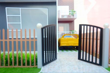 Yard of home(shallow depth of field,focus on house and car)の写真素材