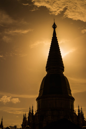 silhouette of Sriwiengchai pagoda in Lamphun Thailandの写真素材