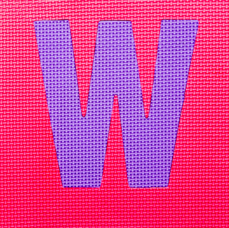 letter "W" on red  backgroundの写真素材