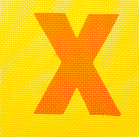 letter "X" on yellow backgroundの写真素材