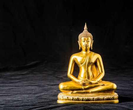 buddha statue on black backgroundの写真素材
