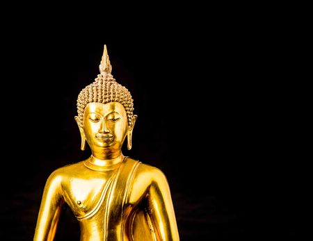 buddha statue on black backgroundの写真素材