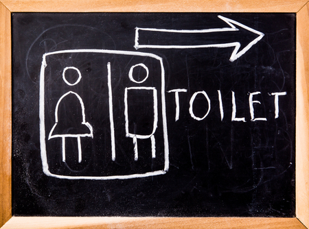 toilet symbol on black boardの写真素材