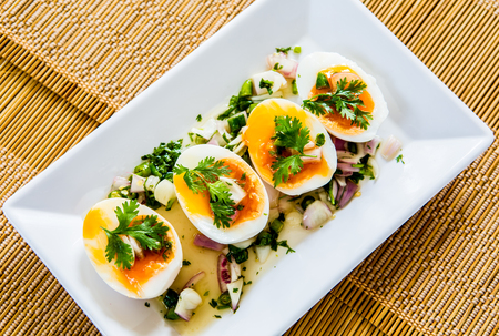 medium-boiled egg with saladの写真素材