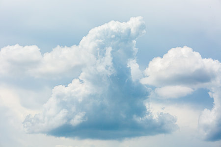 Blue sky background with tiny clouds. Cloudy sky with tiny clouds.の写真素材