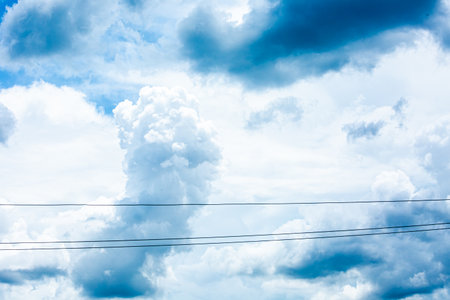 blue sky background with white clouds and power lines, nature abstract background