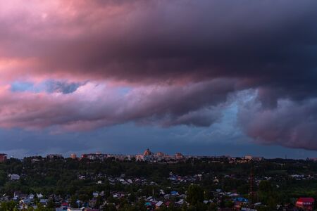 Colorful dawn over the city, beautiful clouds in the sky