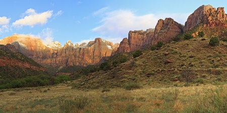 Panorama view of the Towers of the Virgin as the morning clouds burn off in Zion National Park, Utahの写真素材